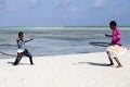 African kids playing with hula hoop on the beach Royalty Free Stock Photo