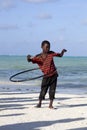 African kid playing with hula hoop on the beach Royalty Free Stock Photo