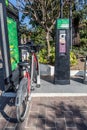 Zapopan, Jalisco Mexico. January 7, 2023. Bike rental ATM with Mibici logo with green trees in the background