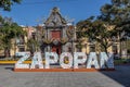 Zapopan, Jalisco Mexico. January 7, 2023. Cityscape of Palacio Municipal with word Zapopan in front against blue sky