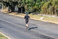 Zapopan, Jalisco Mexico. January 1, 2023. Young man running on a paved street
