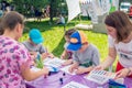 Children participating at calligraphy outdoors workshop