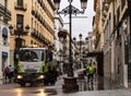 Cleaning worker cleans and disinfects the pedestrian streets in the center of Zaragoza.