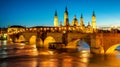 Zaragoza city, Spain, bridge and Cathedral del Pilar at sunset Royalty Free Stock Photo