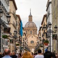 Zaragoza, Spain - April 29, 2023: Large pedestrian street full of shops that will lead to the main square of Pilar.