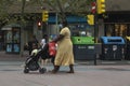 Zaragoza, Spain - August 18, 2020: A black inmigrant woman pushes a stroller Royalty Free Stock Photo