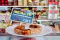 Zaragoza, Spain - July 2019: pieces of traditional pork dish torrezno with price tag on the display of the local foods store
