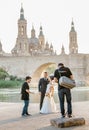 wedding photographer and videographer taking photo and video of bride and groom in city near Ebro