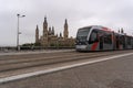 Zaragoza tram crosses the bridge that connects the two sides of the Ebro river.