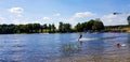 Zarasai, Lithuania - August 07, 2020: people wake boarding on board on warm sunny summer day sliding on water with boards.