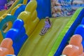 Zarechany, Ukraine - June 10, 2018. Children play on an inflatable carousel. Meeting of residents at the festival of the village