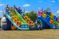 Zarechany, Ukraine - June 10, 2018. Children play on an inflatable carousel. Meeting of residents at the festival of the village