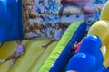 Zarechany, Ukraine - June 10, 2018. Children play on an inflatable carousel. Meeting of residents at the festival of the village
