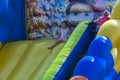 Zarechany, Ukraine - June 10, 2018. Children play on an inflatable carousel. Meeting of residents at the festival of the village