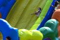 Zarechany, Ukraine - June 10, 2018. Children play on an inflatable carousel. Meeting of residents at the festival of the village