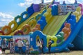 Zarechany, Ukraine - June 10, 2018. Children play on an inflatable carousel. Meeting of residents at the festival of the village