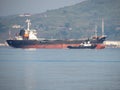 Zarubino.Primorsky kray / Russia - July 22 2018: General cargo ship and tugboat mooring in the port