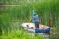 Old fisherman rowing boat. Royalty Free Stock Photo