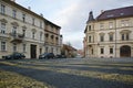 Zatec, Czech republic - November 05, 2019: houses, cars and yellow lines on Chmelarske namesti in autumnal afternoon