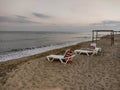 Zatoka, Odessa, Ukraine - September 4, 2021: Beach scene after sunset. Beach loungers on the Black Sea coast. Mobile photography Royalty Free Stock Photo