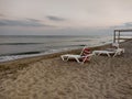 Zatoka, Odessa, Ukraine - September 4, 2021: Beach scene after sunset. Beach loungers on the Black Sea coast. Mobile photography Royalty Free Stock Photo