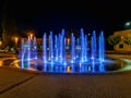 Zawiercie August 28 2018 Spiral splashing fountain at city center in cloudy day at night