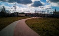 Long curvy path to playground with green fields around