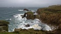 Zawn Wells with Rock Arch of Enys Dodnan Royalty Free Stock Photo