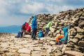 Hikers travel in the Babia Gora Mountain with a backpack