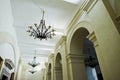 Zbarazh, Ukraine - July 24, 2018: Gorgeous and elegant chandeliers hanging on the ceiling in the hall.