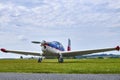 Front view of Zlin Z-43 four-seat airplane standing on a grass runway.  Low-wing monoplane Royalty Free Stock Photo