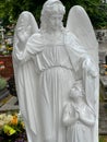 Zbroslawice, Poland, July 1, 2023: Monument to the lost child in the cemetery at the Church of the Assumption of Mary and the