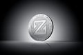 Zcoin cryptocurrency physical coin concept on gently lit dark background.