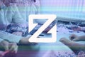 ZCoin, XZC cryptocurrency sign. The concept of business, cryptocurrency and finance - a team of businessmen are sitting in an