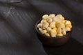 Zea mays - Wooden bowl with fresh corn kernels Royalty Free Stock Photo