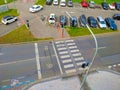 Zebra crossing seeing from the top with car parking next to it