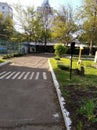 Zebra marking road and a toylike traffic light nearby