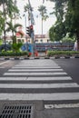 a zebracross for pedestrian to cross. surabaya, indonesia - 6 maret 2024