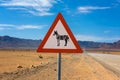 Zebras crossing warning road sign placed in the desert of Namibia Royalty Free Stock Photo