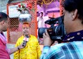 Zee news personals asking a sadhu about spirituality at simhasth great kumbh mela 2016, Ujjain India Royalty Free Stock Photo