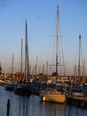 Port Bonshaven , at sunset ,overlooking the jettys, with moored yachts Royalty Free Stock Photo