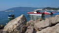 Zelenika, Herceg Novi, Montenegro, 08.10.2022 Rocky sea coast with the beach of Zelenika village. Boats and boats at