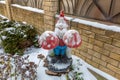 Funny figurine as an element of decoration of a garden or yard in winter