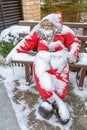 Funny figurine as an element of decoration of a garden or yard in winter