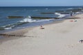 Lonely man sitting on sandy Baltic beach Royalty Free Stock Photo