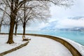 Zell am See in winter. Esplanade along Lake Zell, snow, frozen trees and misty mountain in alpine town. Famous ski Royalty Free Stock Photo