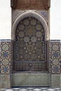 Zellige tiled water fountain with abstract flower patterns