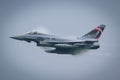 Austrian Air Force Eurofighter military aircraft on high speed with lots of condensation Royalty Free Stock Photo