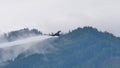 Combat fighter jet in flight at high angle of attack in nature landscape sky