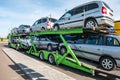 ZELVA, BELARUS - SEPTEMBER 2019: Car carrier truck loaded with many cars in the parking lot